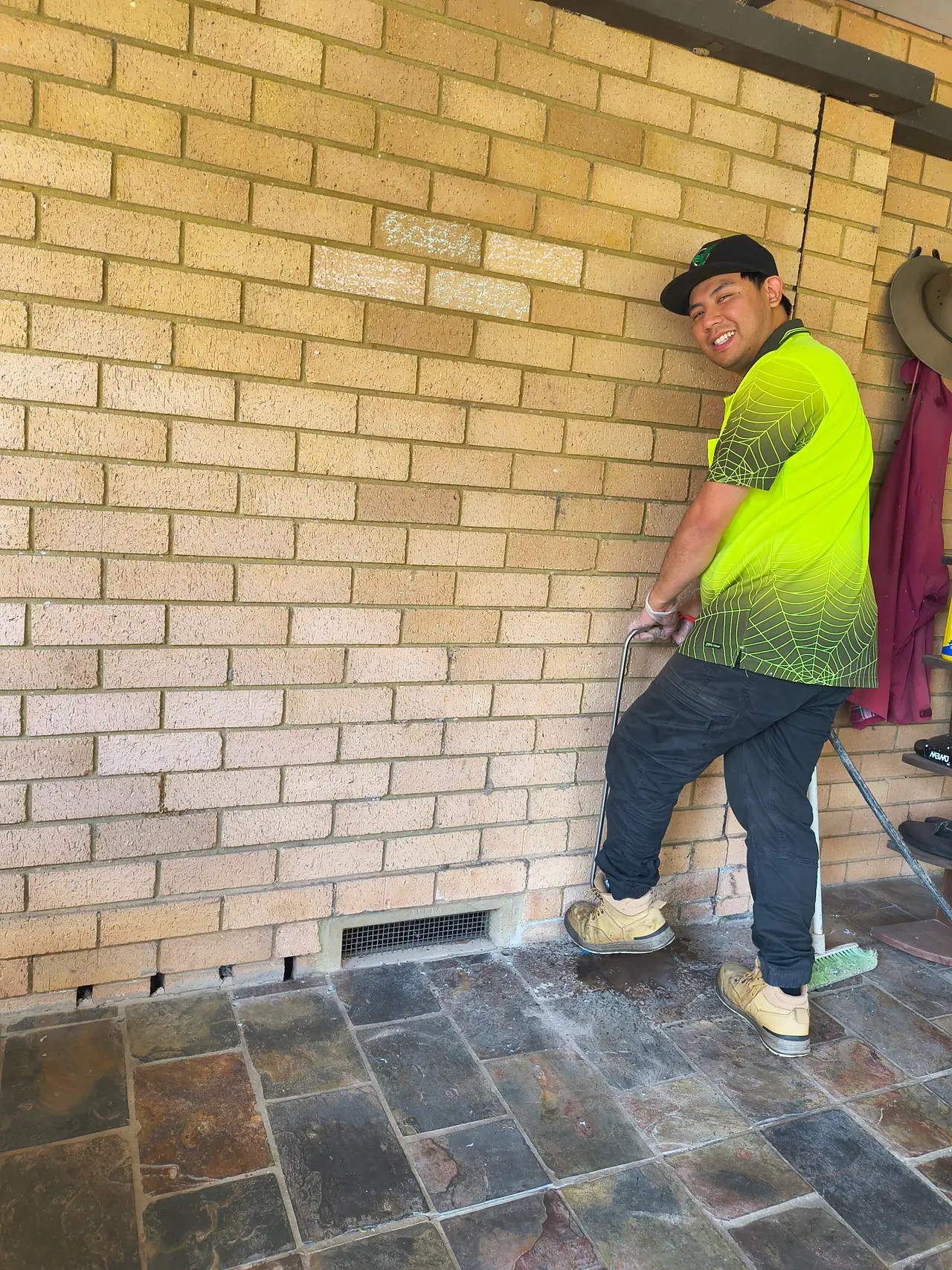 Mark treating the perimeter and weep holes of a Sydney home for general pest