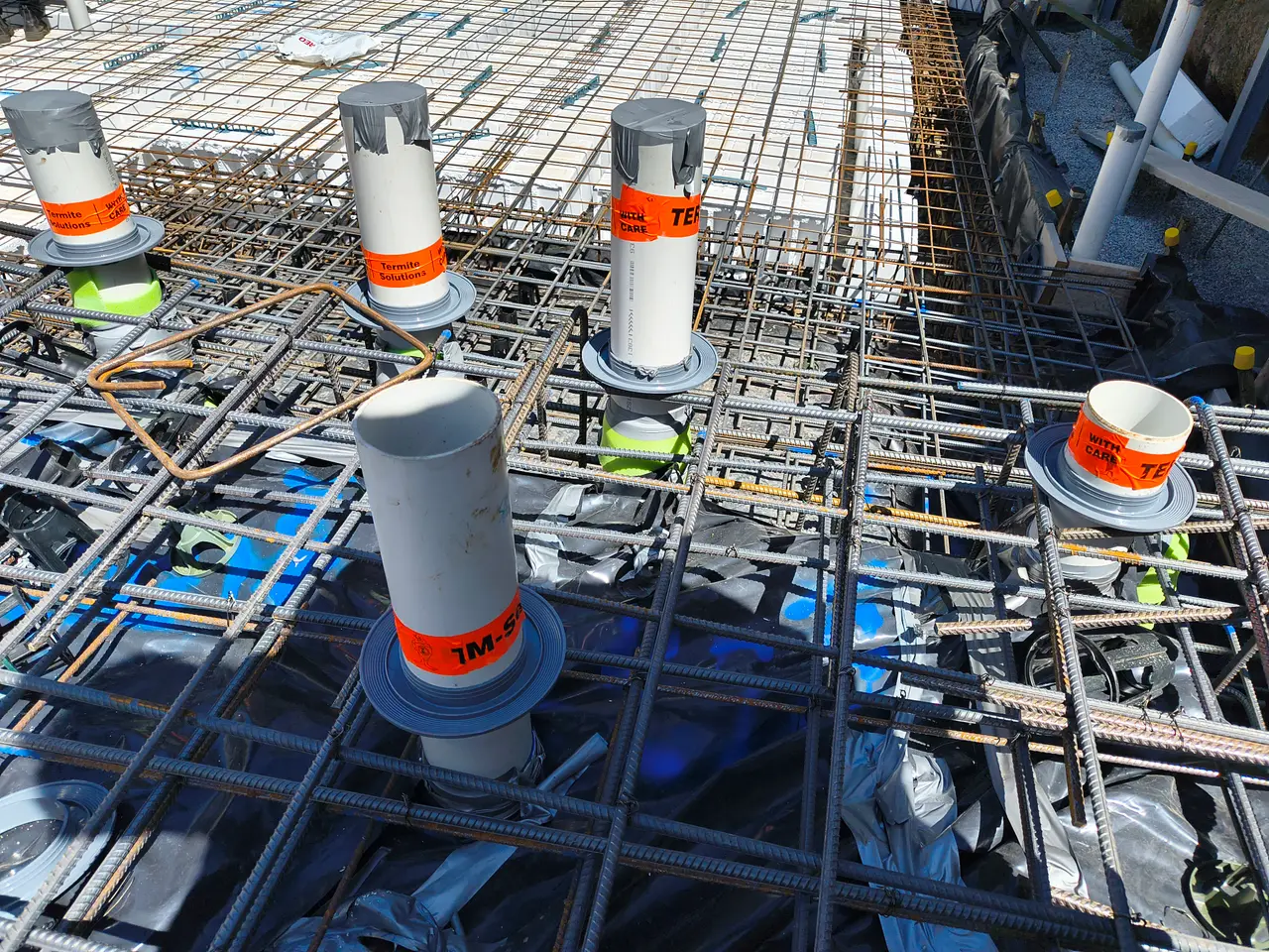 Termite barrier reticulation system installed in a slab before pouring